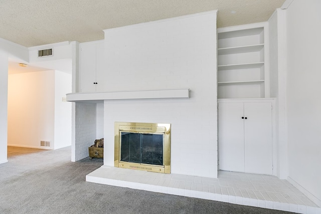 unfurnished living room featuring built in features, crown molding, a brick fireplace, light carpet, and a textured ceiling