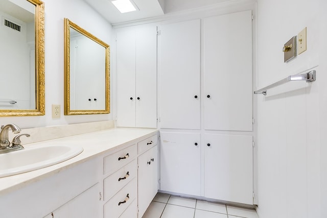 bathroom with tile patterned flooring and vanity