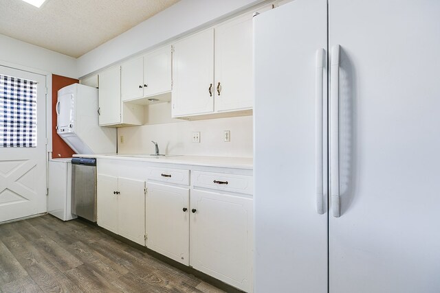 kitchen featuring white cabinetry, sink, stainless steel dishwasher, and white refrigerator