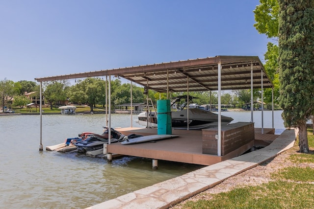 view of dock featuring boat lift and a water view