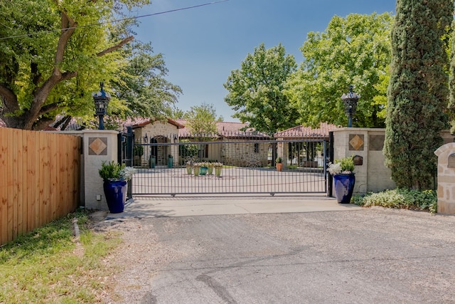 view of gate with fence