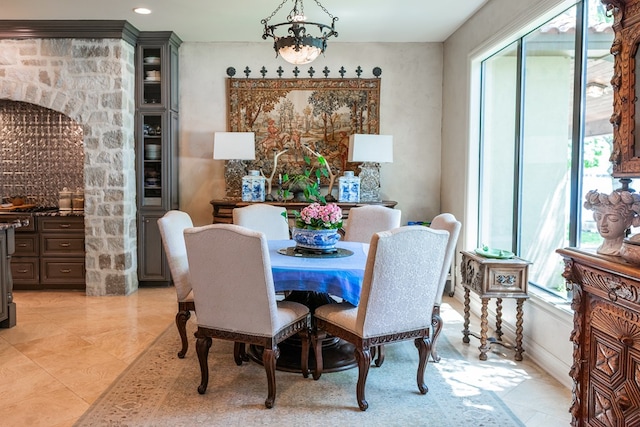 dining room featuring a wealth of natural light and light tile patterned flooring