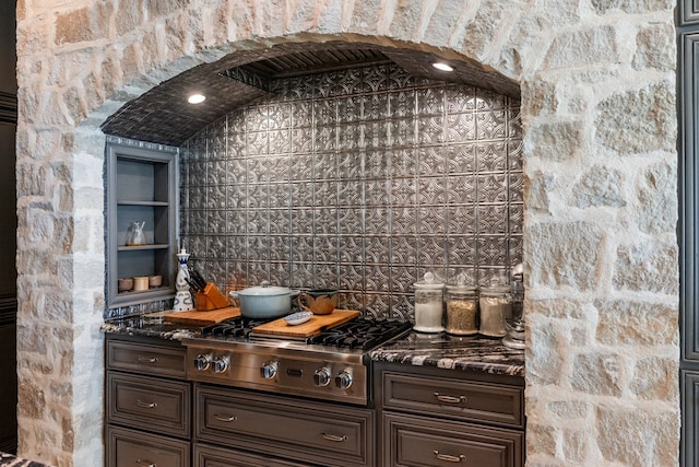 kitchen featuring stainless steel gas stovetop and dark brown cabinetry