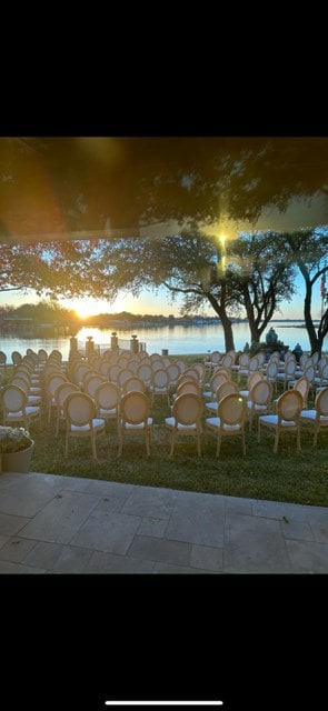 view of patio / terrace featuring outdoor dry bar and a water view