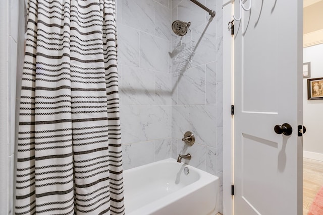 bathroom featuring shower / bath combo with shower curtain