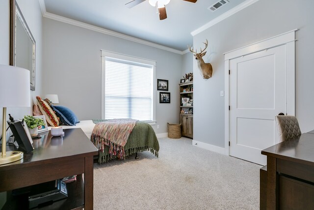 bedroom featuring visible vents, a ceiling fan, crown molding, baseboards, and carpet flooring