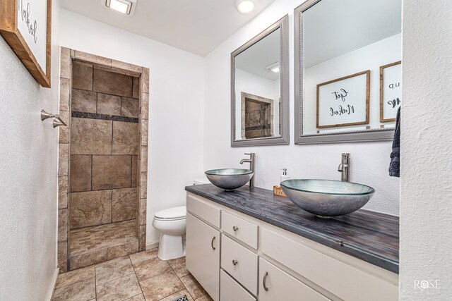 412 E Holmes Ave, Bronte, TX 76933 - full bathroom with double vanity and tiled shower