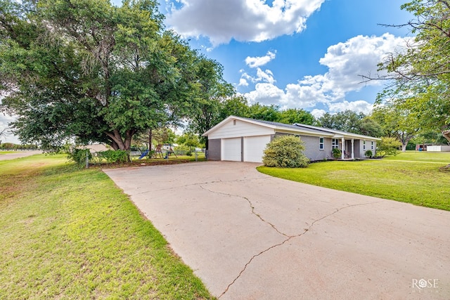 412 E Holmes Ave, Bronte, TX 76933 - view of property exterior featuring a yard, driveway, and an attached garage