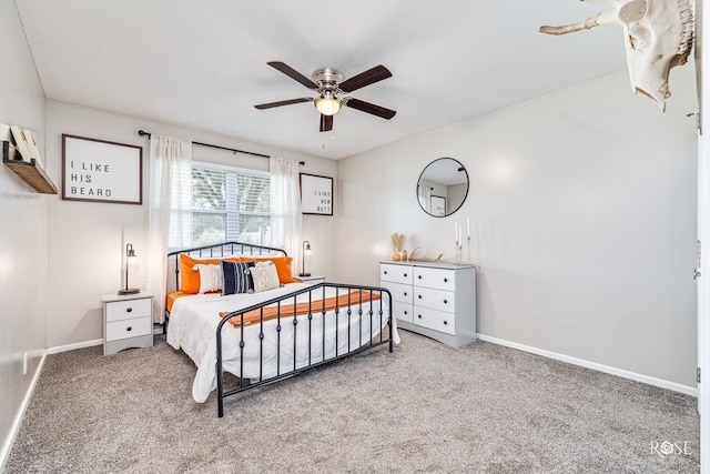 412 E Holmes Ave, Bronte, TX 76933 - carpeted bedroom with baseboards and ceiling fan