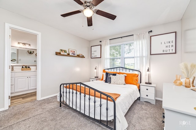 412 E Holmes Ave, Bronte, TX 76933 - carpeted bedroom with connected bathroom and a ceiling fan