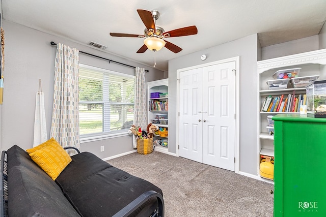 412 E Holmes Ave, Bronte, TX 76933 - living area with carpet floors and a ceiling fan