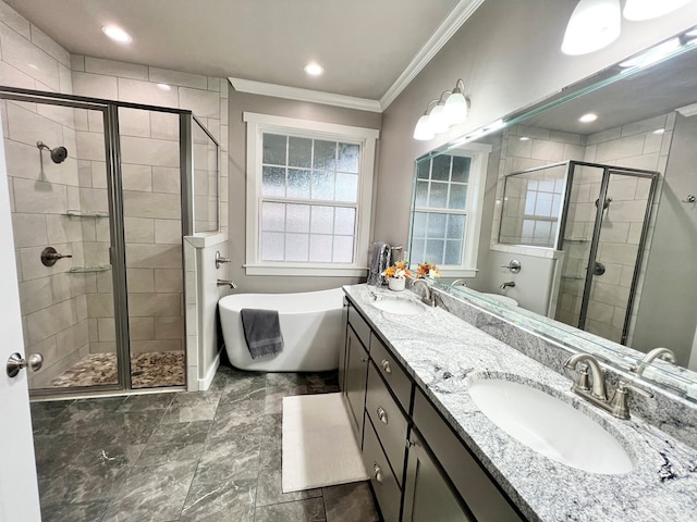 bathroom with crown molding, vanity, and shower with separate bathtub