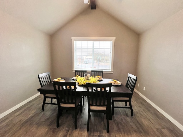 dining space with dark hardwood / wood-style flooring and vaulted ceiling