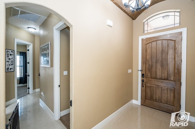 entrance foyer featuring an inviting chandelier