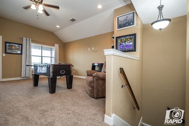 rec room featuring lofted ceiling, light carpet, and ceiling fan