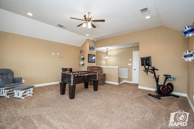 rec room featuring ceiling fan, vaulted ceiling, and carpet