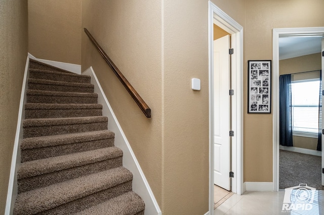 staircase with tile patterned flooring