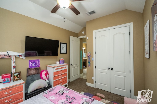 carpeted bedroom featuring ceiling fan, lofted ceiling, and a closet