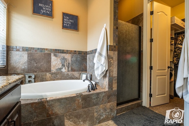 bathroom with vanity and plus walk in shower