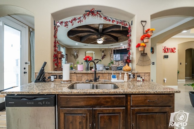 kitchen featuring dishwasher, sink, crown molding, light stone countertops, and dark brown cabinets