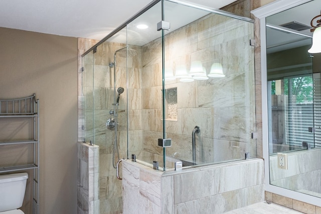 3705 Gemini Dr, San Angelo, TX 76903 - bathroom featuring a stall shower and toilet