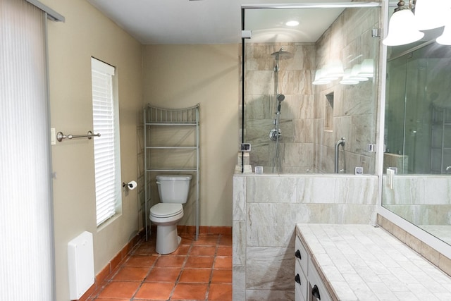 3705 Gemini Dr, San Angelo, TX 76903 - full bath with a stall shower, toilet, tile patterned flooring, and baseboards