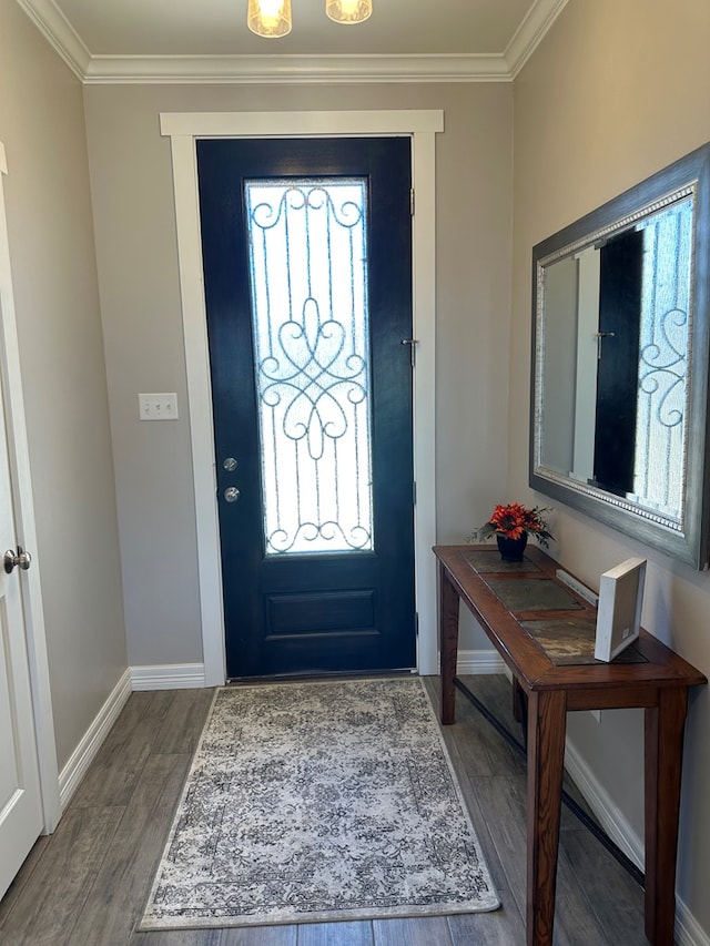 entryway with hardwood / wood-style flooring and crown molding