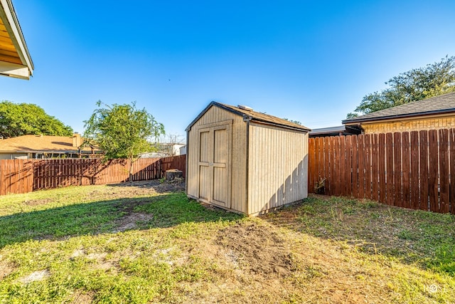 view of outbuilding featuring a lawn