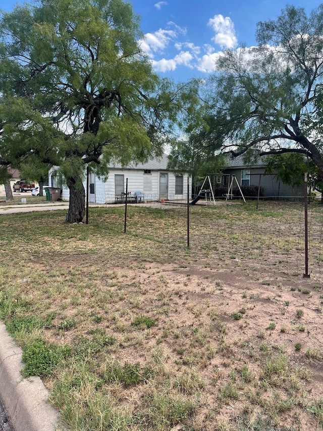 2402 Juanita Ave, San Angelo, TX 76903 - view of yard featuring a playground