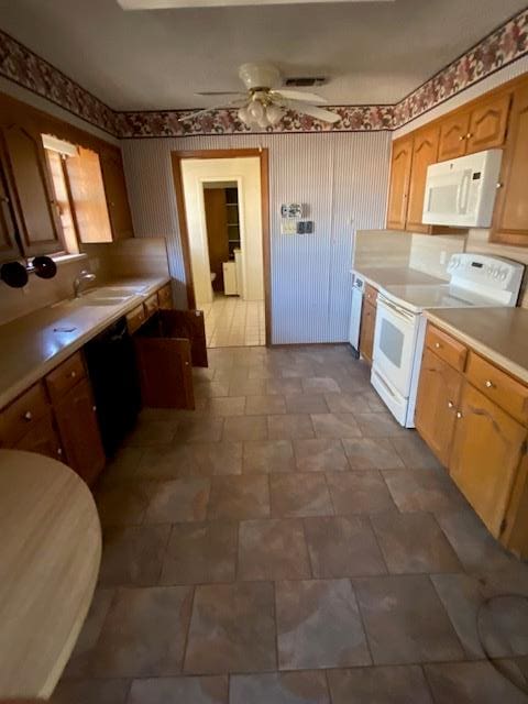 kitchen with ceiling fan, sink, and white appliances