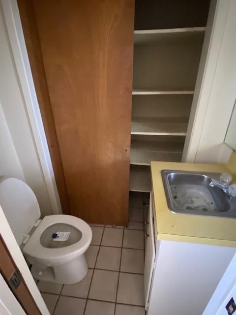 bathroom featuring tile patterned flooring, sink, and toilet