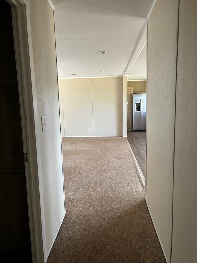 corridor with carpet flooring