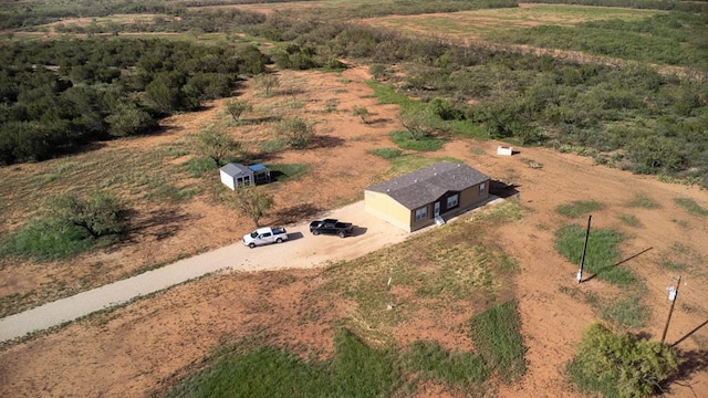 birds eye view of property with a rural view