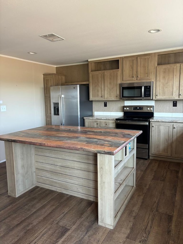 kitchen featuring wood counters, stainless steel appliances, dark hardwood / wood-style floors, and a center island