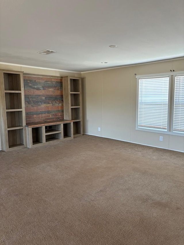 unfurnished living room featuring carpet flooring