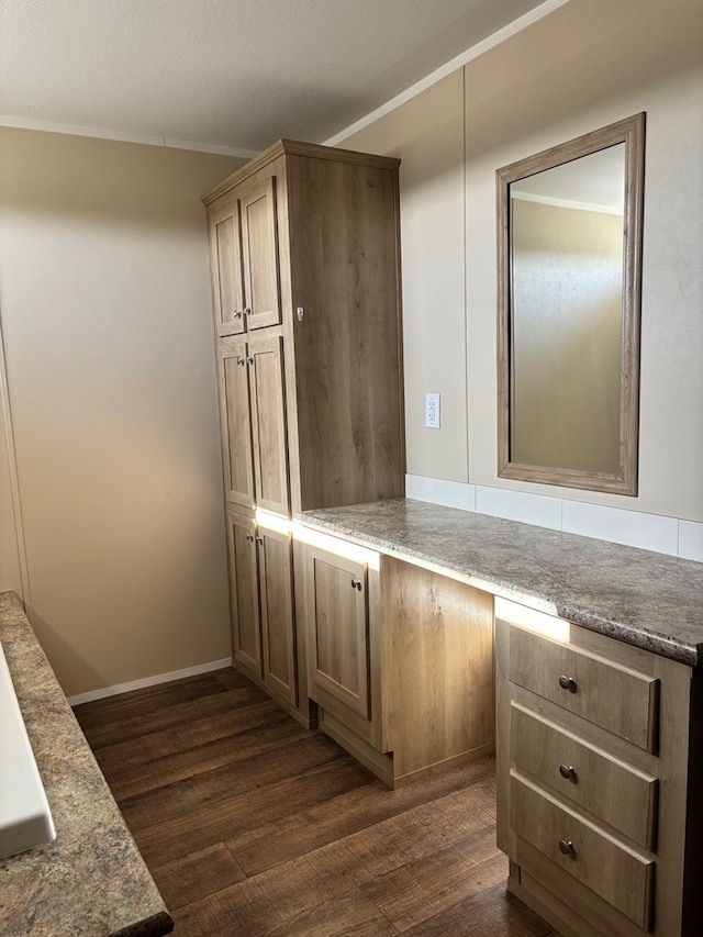 bathroom featuring crown molding, hardwood / wood-style floors, and vanity