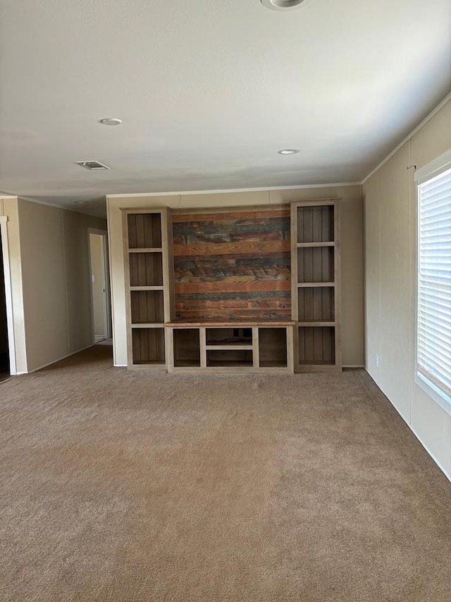 unfurnished living room featuring carpet