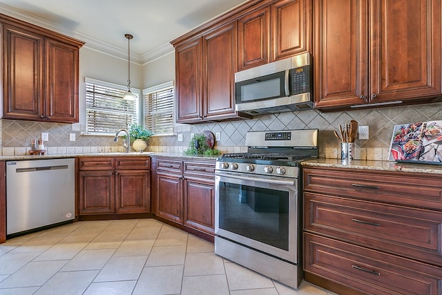 4333 Chisholm Trl, San Angelo, TX 76903 - kitchen featuring appliances with stainless steel finishes, light stone counters, light tile patterned floors, a sink, and decorative backsplash