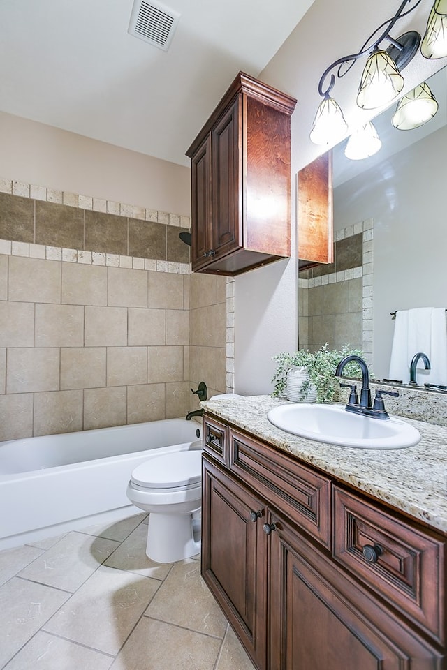 4333 Chisholm Trl, San Angelo, TX 76903 - full bathroom with vanity, toilet, tile patterned flooring, and bathing tub / shower combination