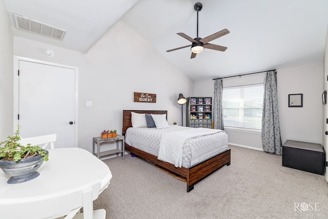 bedroom featuring high vaulted ceiling, light colored carpet, and ceiling fan