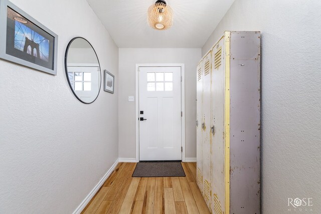 doorway to outside with hardwood / wood-style flooring