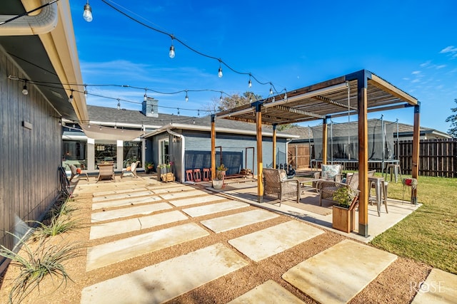 view of patio / terrace with an outdoor living space, a pergola, and a trampoline