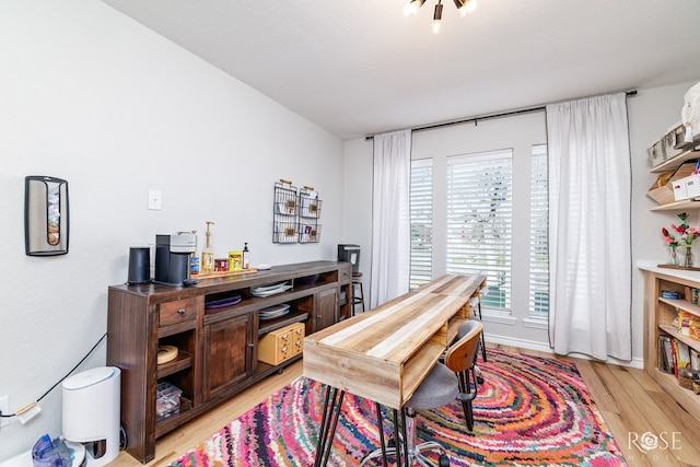 office space with light wood-type flooring