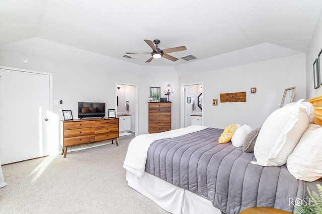 carpeted bedroom featuring connected bathroom and ceiling fan