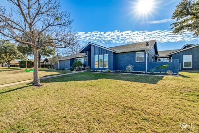 view of front of home with a front lawn