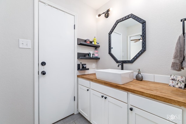 bathroom with vanity and tile patterned flooring