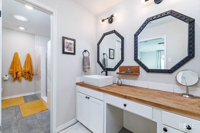 bathroom with vanity and a shower with shower door