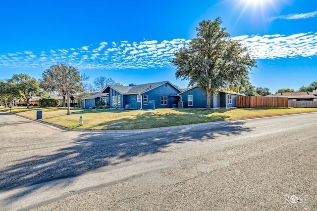 ranch-style house featuring a front lawn