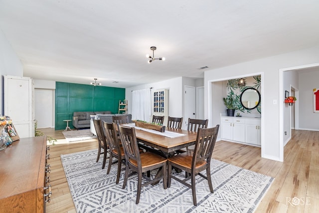 dining room with light wood-type flooring