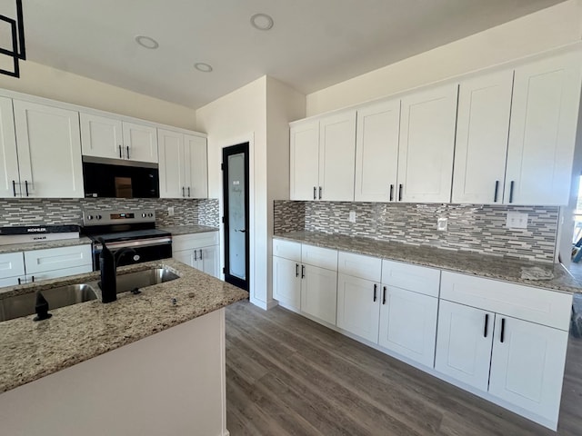 kitchen featuring a sink, white cabinetry, stainless steel electric range, light stone countertops, and dark wood-style floors